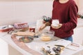 Cropped woman holding jar with flour over bowl Royalty Free Stock Photo