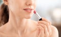 Cropped of woman using lipstick, copy space Royalty Free Stock Photo