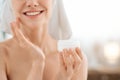 Cropped of young woman applying face cream Royalty Free Stock Photo