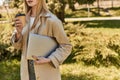 cropped young woman in trench coat