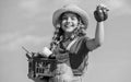 Crops harvest. Harvest season. Child carry harvest sky background. Organic food. Sunny day at farm. Vegetables in basket Royalty Free Stock Photo