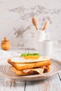 Croque madame sandwich with ham, cheese and egg on a plate on the table vertical view Royalty Free Stock Photo