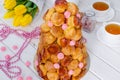 Croquembouche with pink roses and caramel threads.