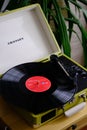 Crosley portable turntable playing long play record