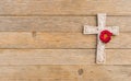 Cross background, religious christian stone cross and rose blossom on wood for death and grief concept Royalty Free Stock Photo