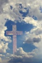 Cross behind clouds