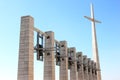 Cross and bells near Padre Pio Church, Italy Royalty Free Stock Photo