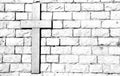 Cross carved on marble attached to the stone wall Royalty Free Stock Photo