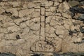 Cross carved on top of a main cottage door