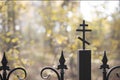 Cross on the cast-iron fence of the church Royalty Free Stock Photo