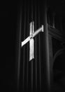 Cross in cathedral in black and white
