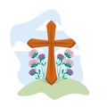 Cross catholic with flowers in grass