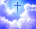 The cross of Christ appeared brightly in the sky with beautiful fluffy white clouds. Royalty Free Stock Photo