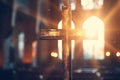 Cross in a church shined by sun rays. Bokeh effect in background. Generative Ai