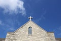 Cross on Church Steeple of Old Christian Stone Temple Royalty Free Stock Photo