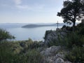 Cross on a cliff in park forest Marjan