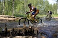 Cross country bike race. Overcoming a water obstacle.