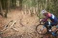 Cross-country cyclist resting on bike with water bottle Royalty Free Stock Photo