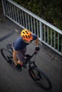 Cross country mtb biker going for his favorite hills beyond the city limits Royalty Free Stock Photo