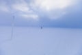 Cross country skier skiing in windy weather