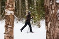 Young man cross-country skiing in the forest Royalty Free Stock Photo