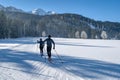 Couple cross-country skiing in beautiful nordic winter landscape in Leogang, Tirol, Alps, Austria Royalty Free Stock Photo