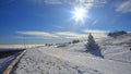 Cross country skiing track on a snowy mountain road above clouds on a sunny inversion day, Jeseniky, Czech Republic Royalty Free Stock Photo