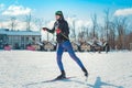 Cross-country skiing woman doing classic nordic cross country skiing in trail tracks in snow covered forest Royalty Free Stock Photo