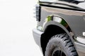 Cross-country vehicle for off road adventures in urban dirt tracks or all-terrain vehicle tire with grip and deep profile military Royalty Free Stock Photo