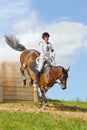 Cross-Country, woman horseback on jumping horse