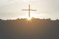 Cross crucifixion of jesus christ on a mountain silhouette with a sunset background. Easter concept day or Good friday. Royalty Free Stock Photo