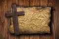 Cross cut out of wood on the old paper Royalty Free Stock Photo