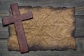 Cross cut out of wood on the old paper Royalty Free Stock Photo