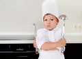 Cross determined little boy chef Royalty Free Stock Photo