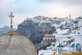 Cross on dome of church in Fira town on Santorini Royalty Free Stock Photo