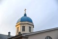 The cross on the dome of the Church of the Tikhvin icon of the m