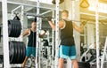 Cross fit body and muscular lifting bar bell weights in the gym,Sport man doing exercises training,Back view Royalty Free Stock Photo