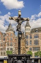 Cross in the foreground and background old buildings. Antwerp Belgium