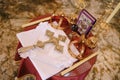 Cross, golden crowns and candlesticks stand on the table in the church. Top view