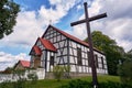 Cross and half-timbered country church