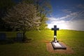 Cross headstone on grave Royalty Free Stock Photo