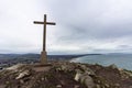 Cross at the highest point in Bray Head overlooking the Irish coastline Royalty Free Stock Photo