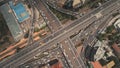 Cross highway top down at Philippines cityscape aerial. Cars, buses, vans, trucks at traffic road