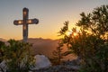 Cross on hill and sunset sky with sunlight Royalty Free Stock Photo