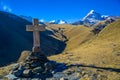 Cross in Kazbegi with view of mountain Kazbek. Royalty Free Stock Photo