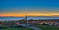 Cross landmark over city lights of Ventura.