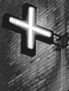 a cross from an LEDin the dark and an electric wd, an advertisement design for a pharmacy on a building