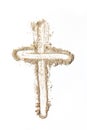 Cross made of ashes on white background