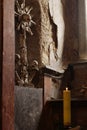 Cross and coat of arms of human bones and skulls on wall of church in Kutna Hora , Czech Republic