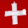 Cross made of white bandages (red background) Royalty Free Stock Photo